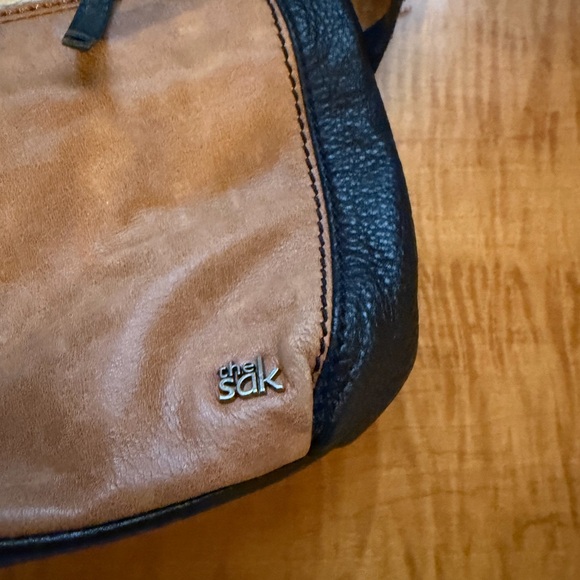 The Sak Laurel Crossbody Bag in a black, tan, and cream color-block design. - Picture 3 of 4